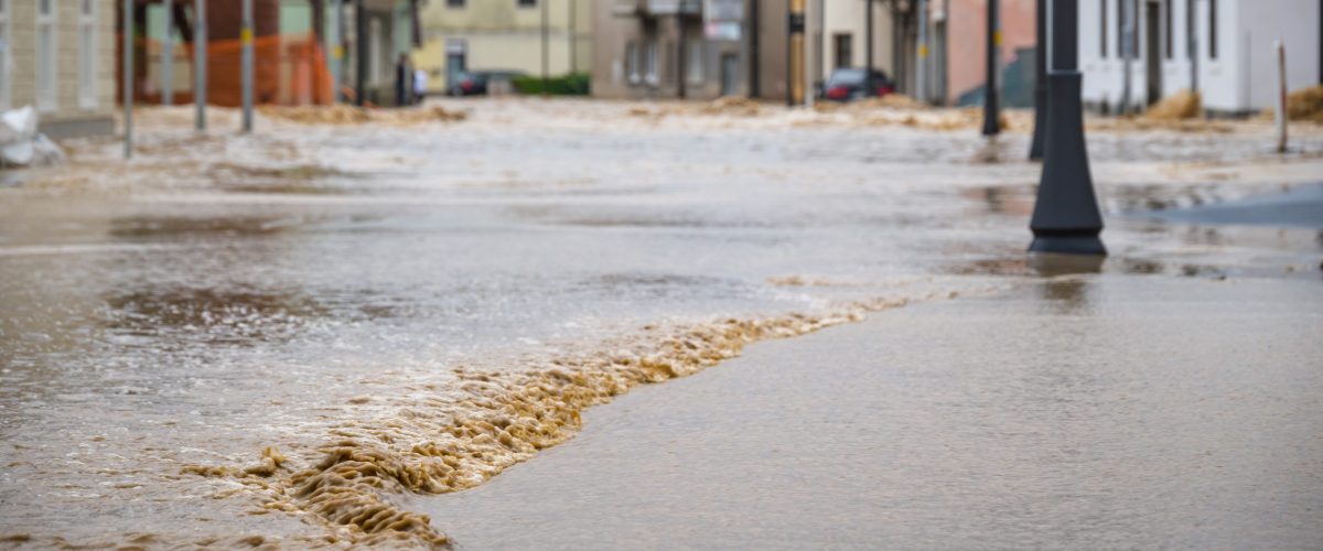 Floods in the city streets after heavy rain. Severe weather disaster.